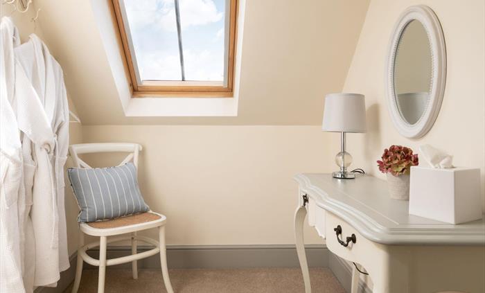 A dressing table in the upstairs bedroom